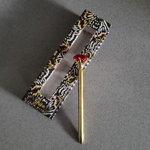 Pen with diamond shape embellishment